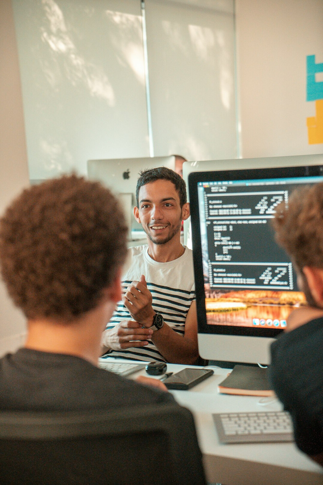 group of students coding together