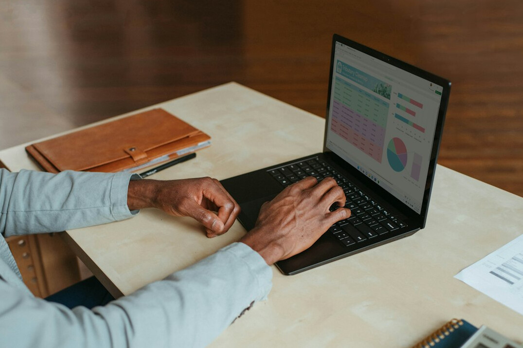 person working remotely on laptop