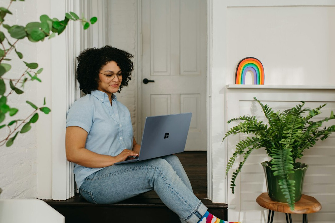 person working on laptop at home