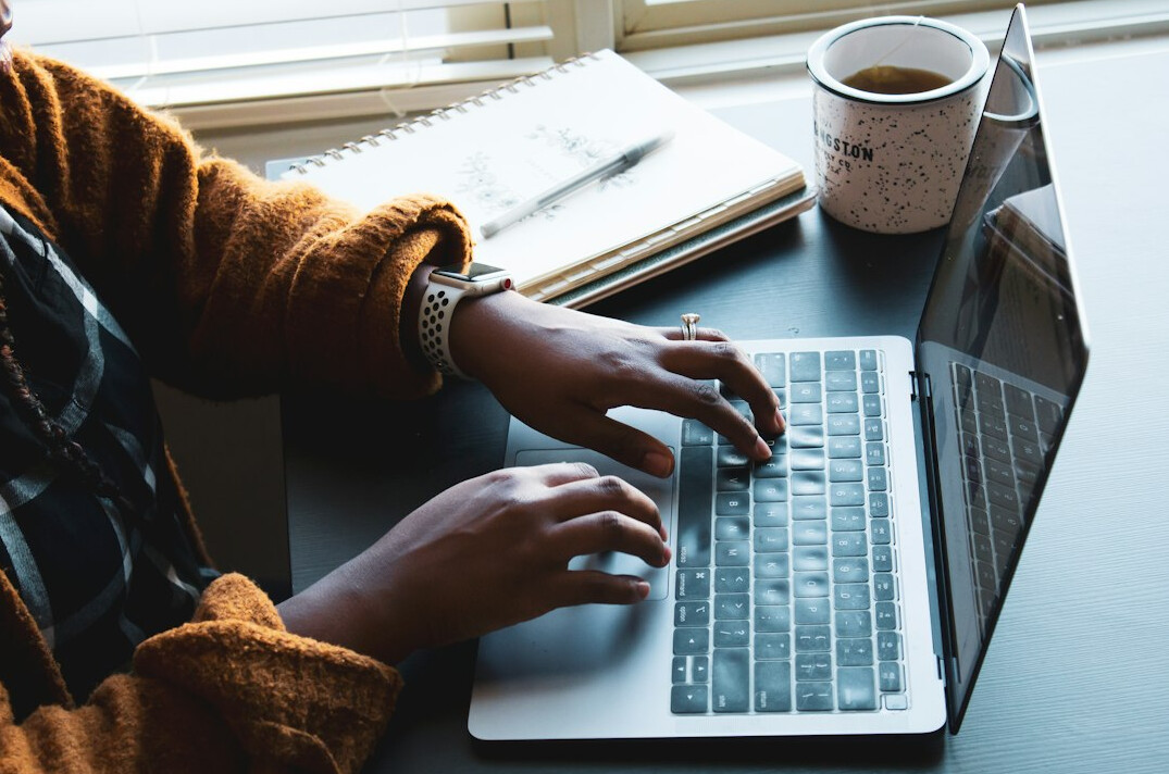 person working on laptop at home