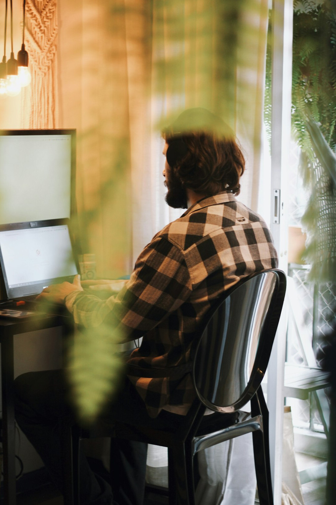 man coding at desk